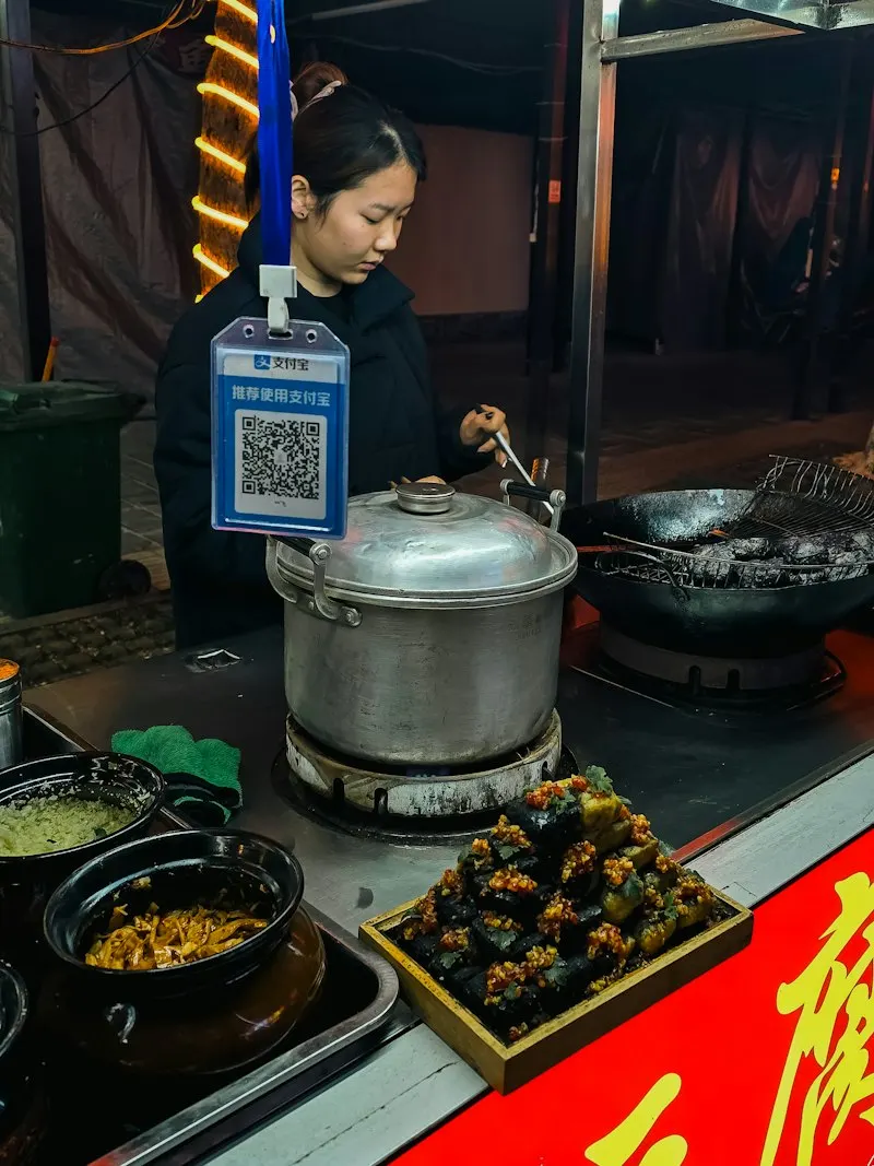 Fried tofu at a street stall, Hunan